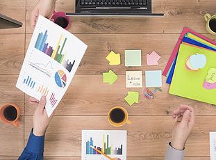 Business team analyzing financial data on a meeting